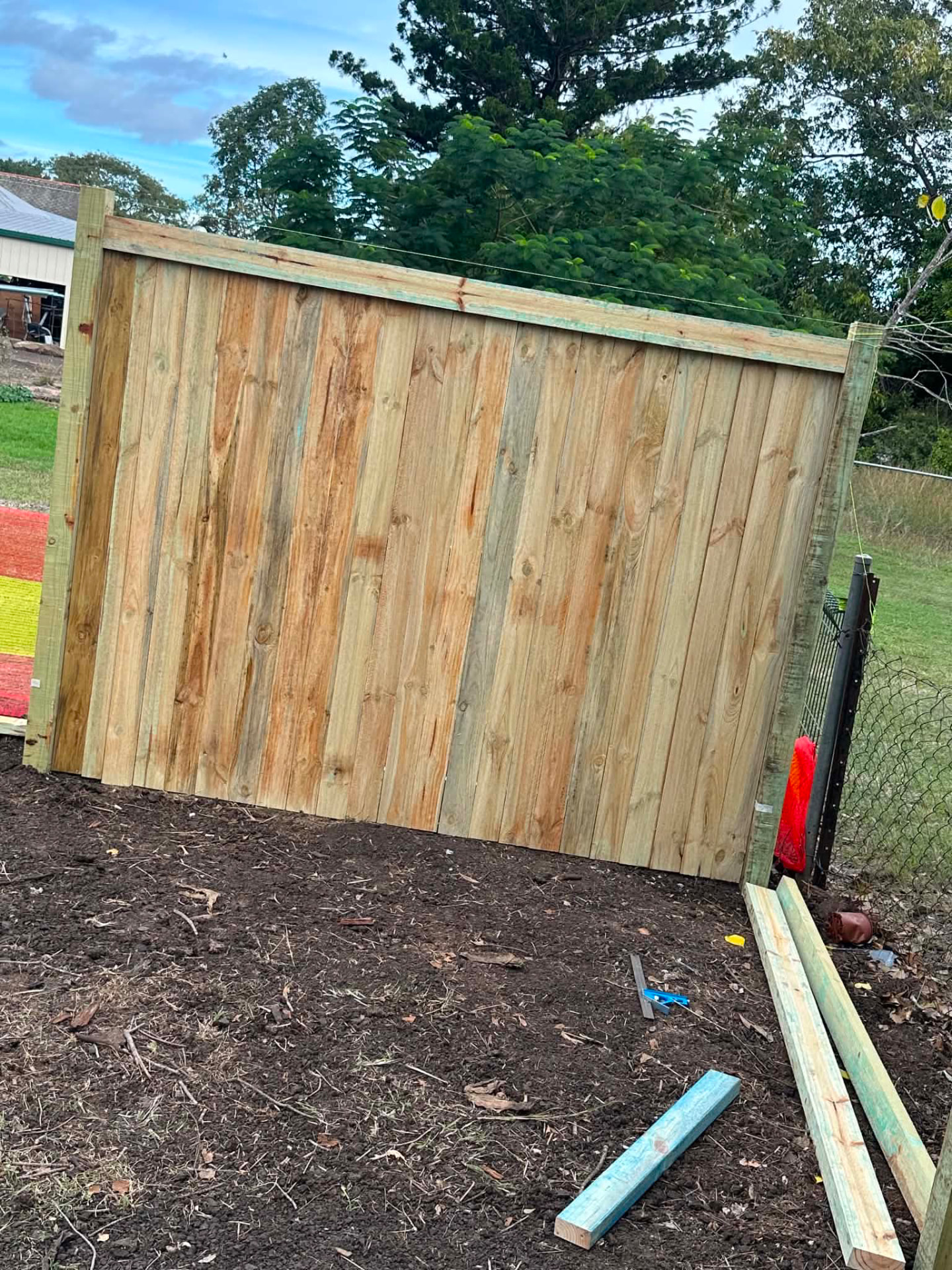 Newly built hardwood paling fence panel
