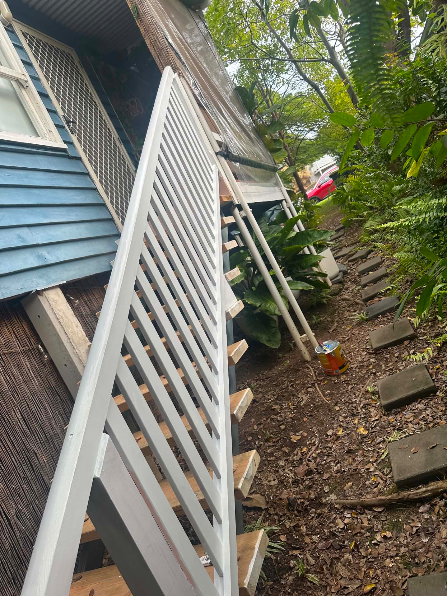 Newly painted white timber balustrade and deck railing